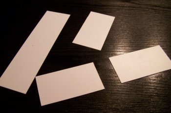 Sheet styrene pieces will make up the removable load for a plate steel gondola.